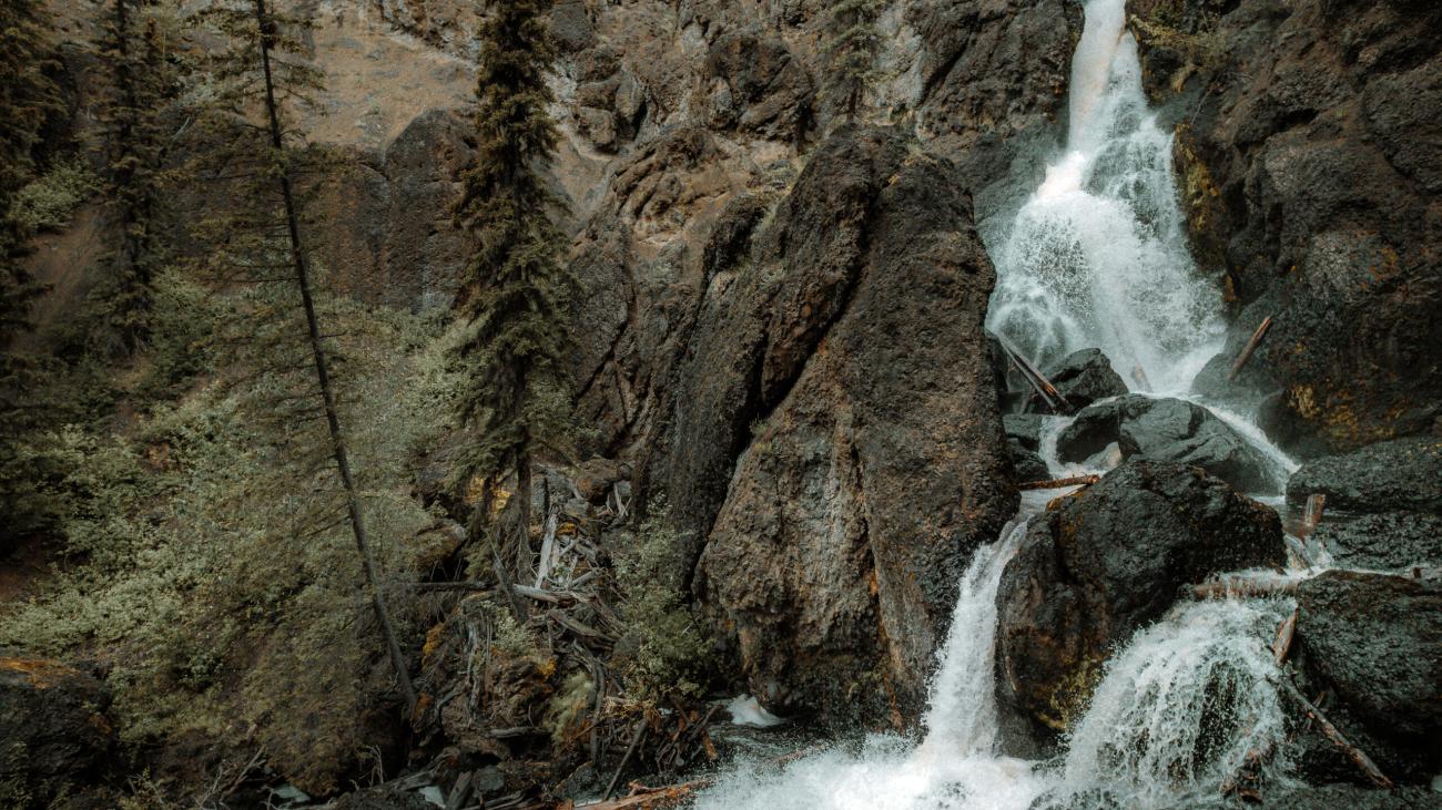 Waterfall cutting through craggy terrain.